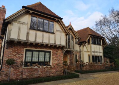 black aluminium replacement windows in tudor house